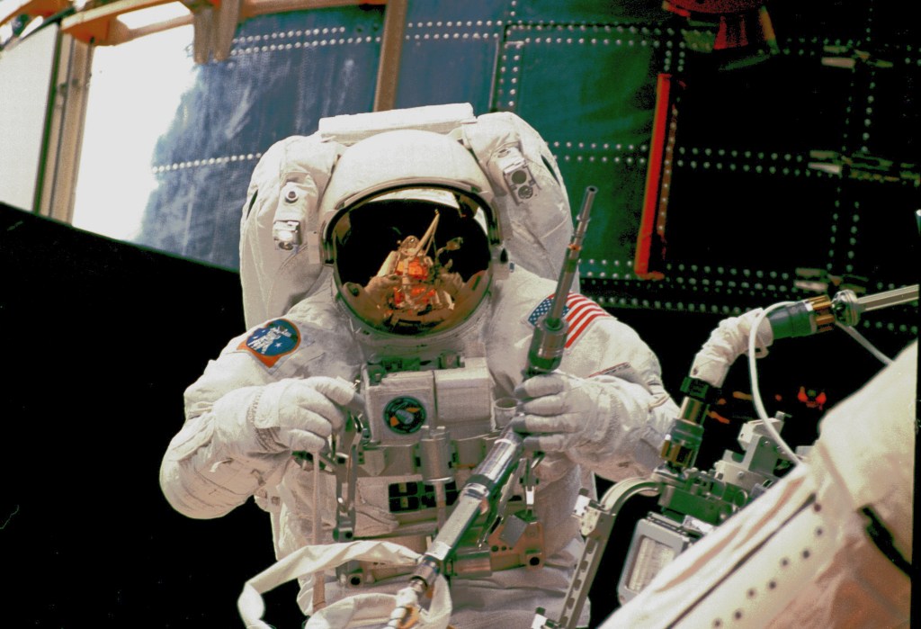 The longest servicing mission, Servicing Mission 4, lasted 12 days, 21 hours, and 37 minutes.